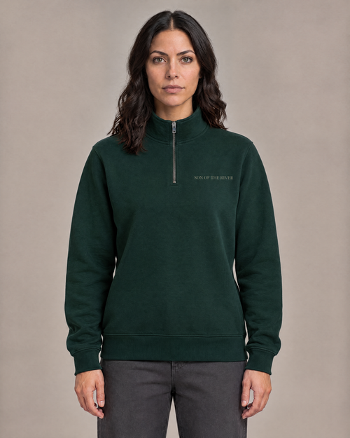 Raya wearing the River Moss Stencil Half Zip — front view.